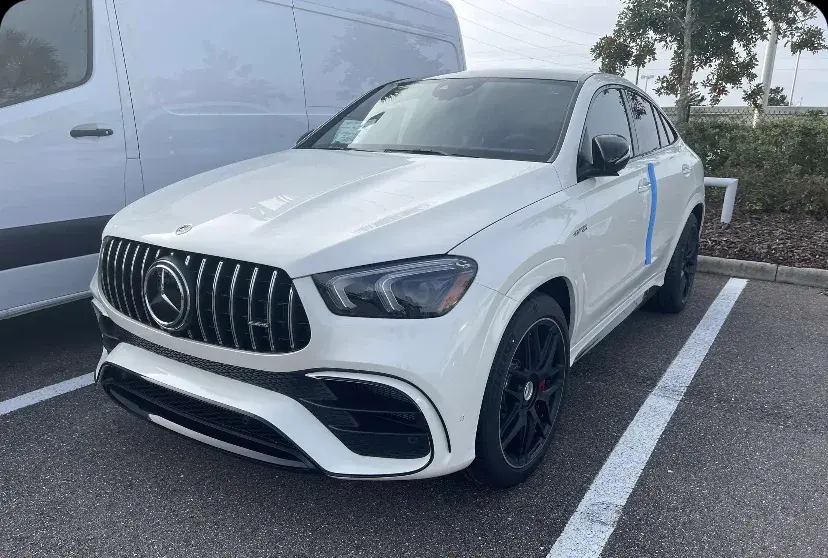 White Mercedes-AMG GLE coupe after a mobile detail in a parking lot